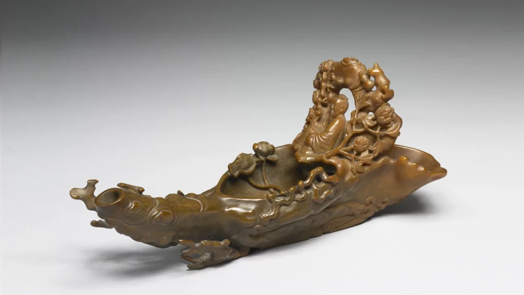 Carved Rhino Horn of a Figure Riding a Raft | By You Tong, Qing Dynasty