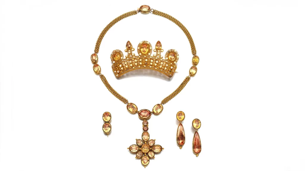 Crown, necklace, earrings, and brooch jewelry made of yellow topaz