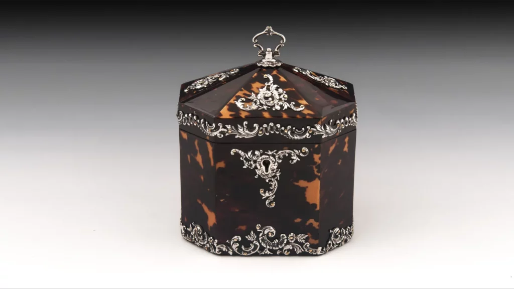 A tea caddy made of tortoiseshell.