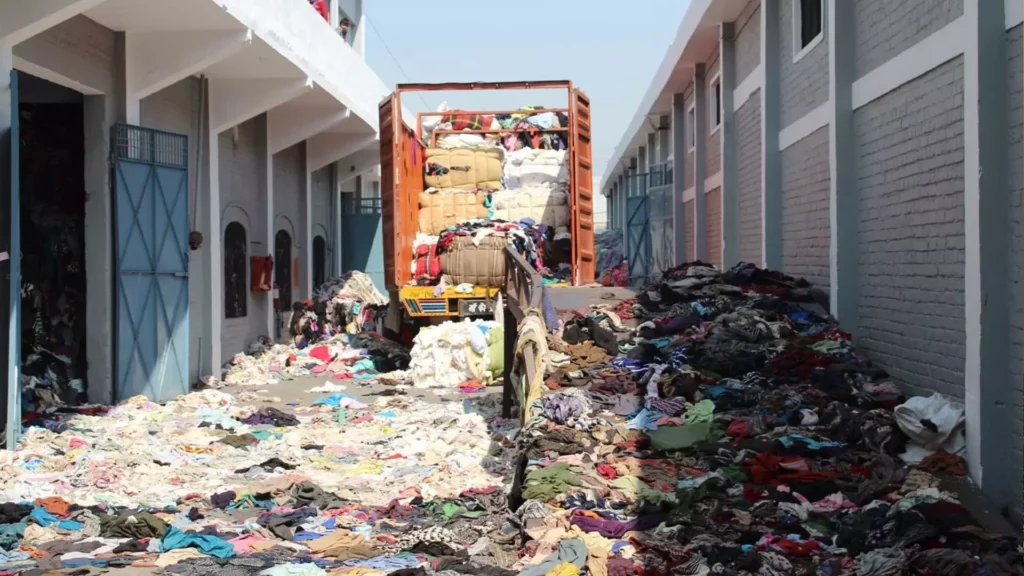 Large amount of used clothes in the recycling plant