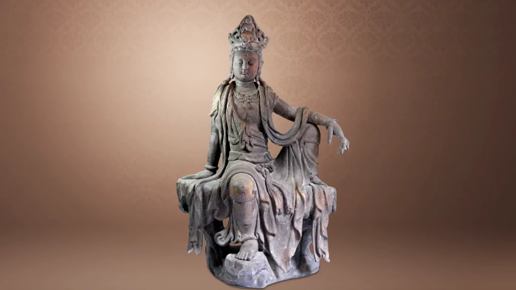 This is a wooden Tang-dynasty statue of seated Guanyin Bodhisattva, also known as Water-Moon Guanyin Bodhisattva.