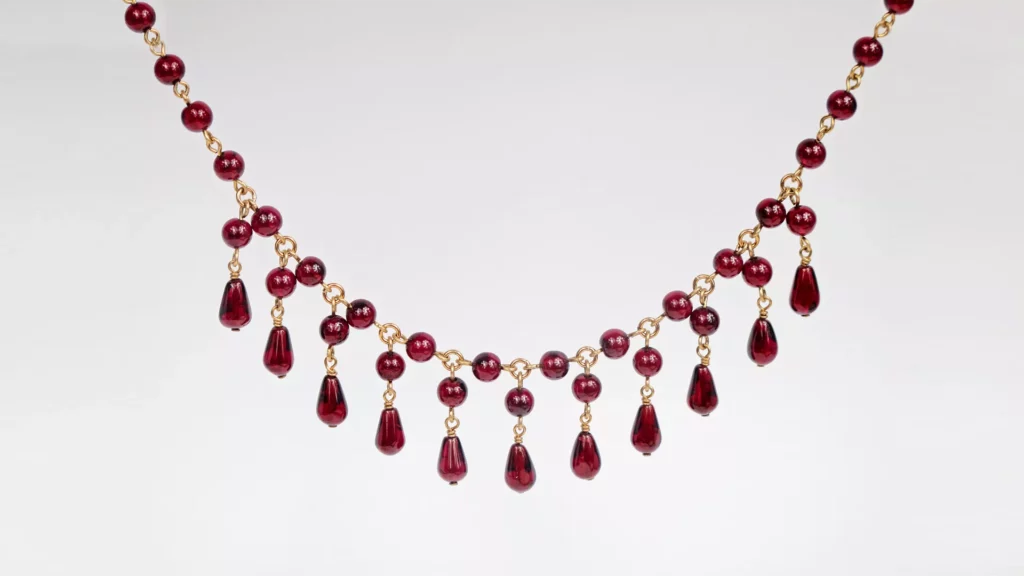 A necklace with multiple red garnets