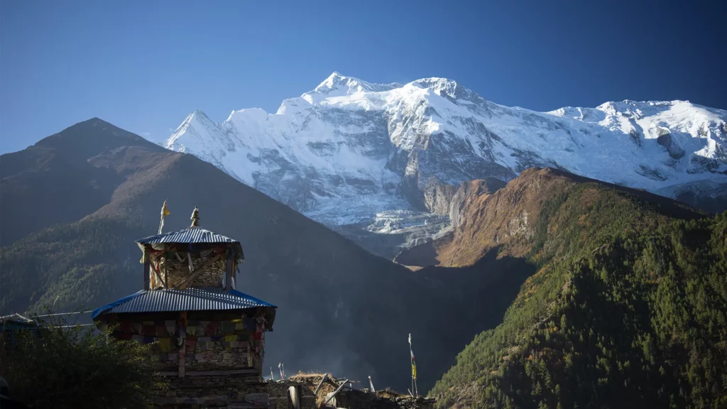 Buddhist stupa and lungta prayer flags in the Himalaya mountains, Annapurna region, Nepal
